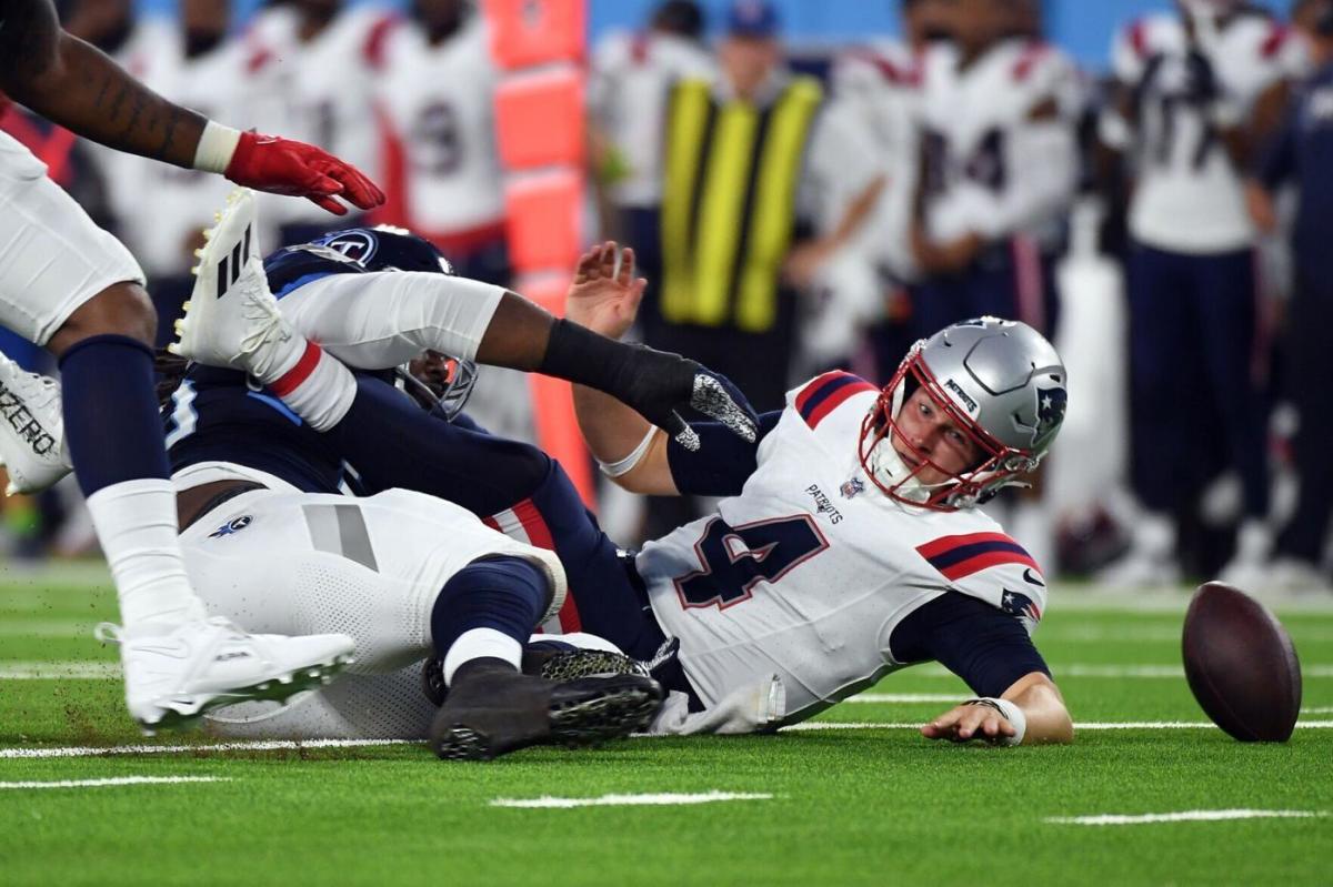 Zappe is sacked during a preseason game against the Tennessee Titans in August.